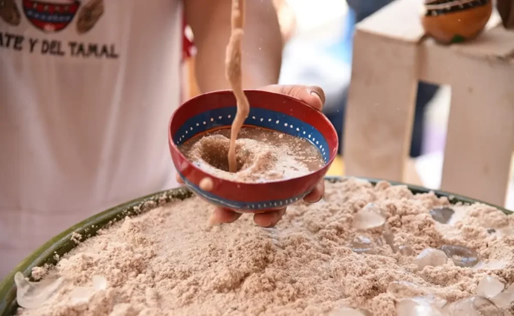 Tejate getting poured into a cup oaxaca