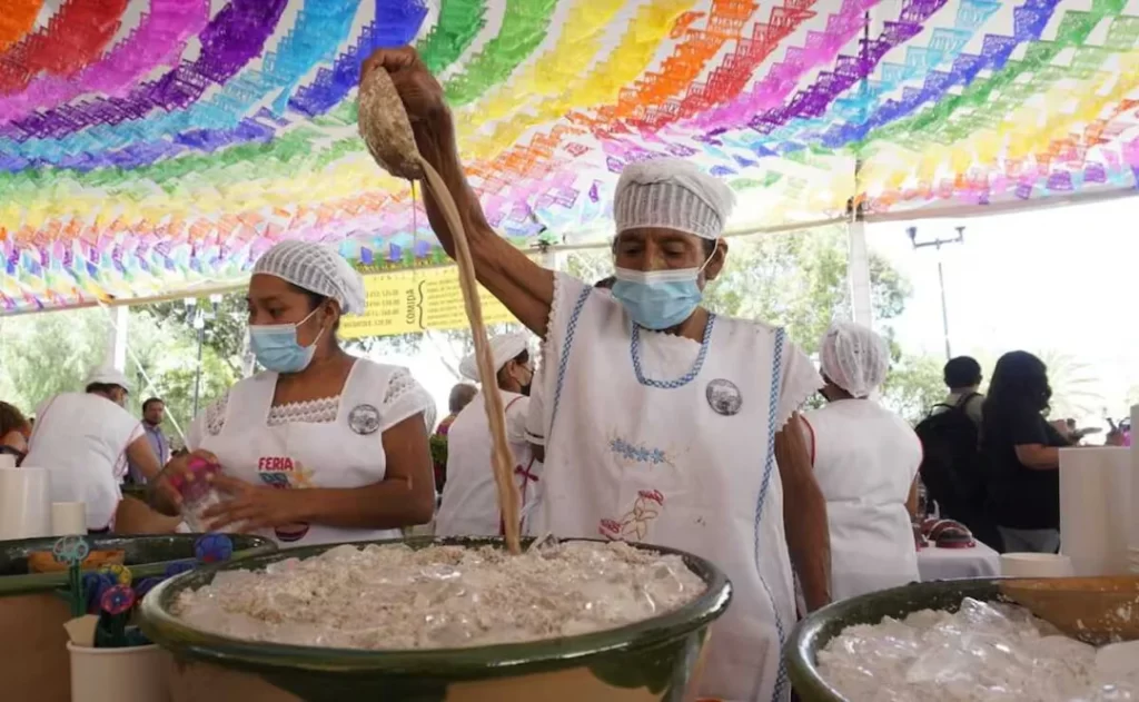 Tejate drink in Oaxaca - feria - lady making tejate