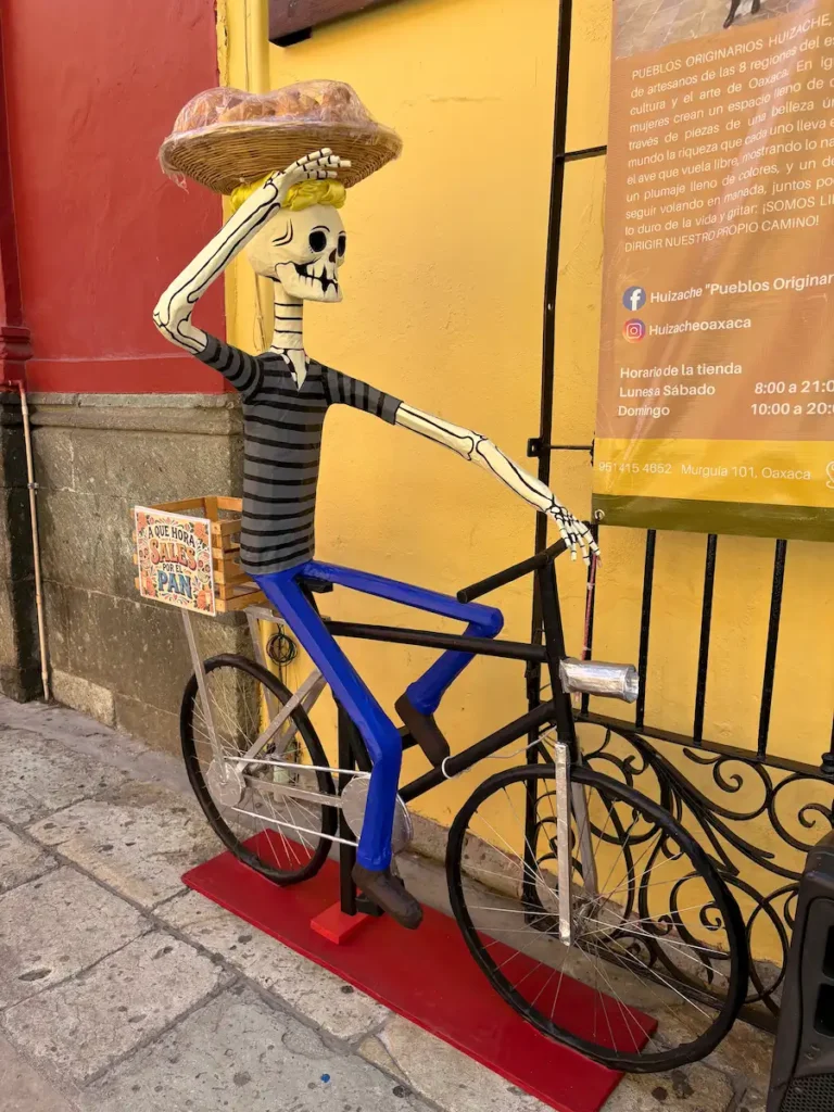 Oaxaca City Day of the Dead street decorations - Catrina riding bike