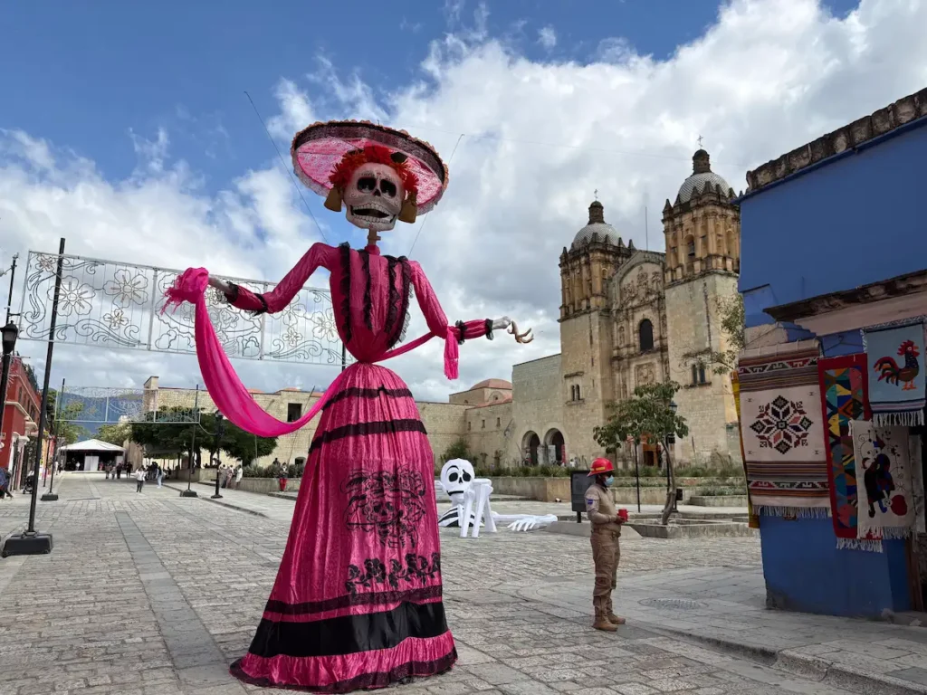 Oaxaca City Day of the Dead street decorations - Catrina in front of Santo Domingo church